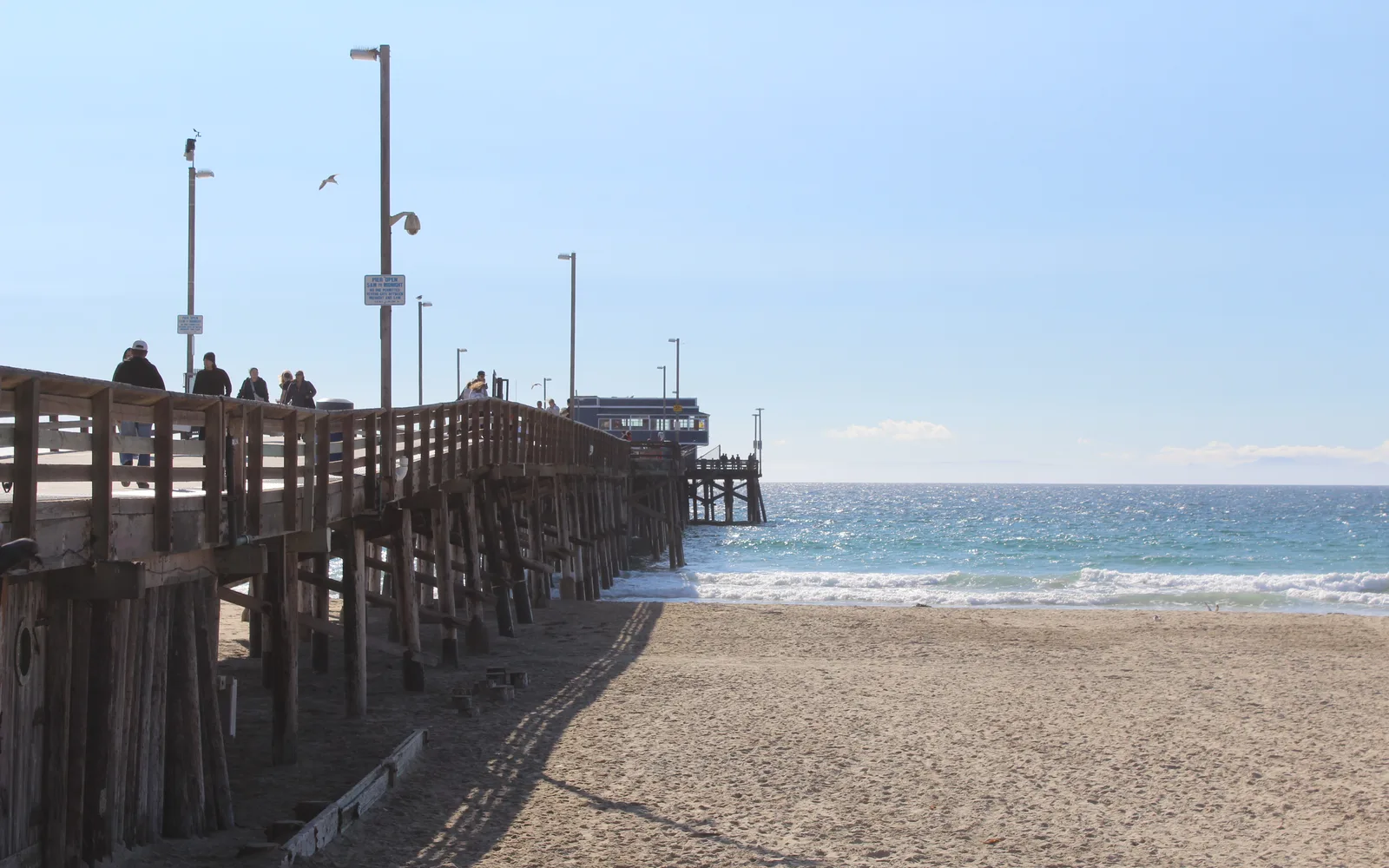 Coastal pier extending into harbor waters