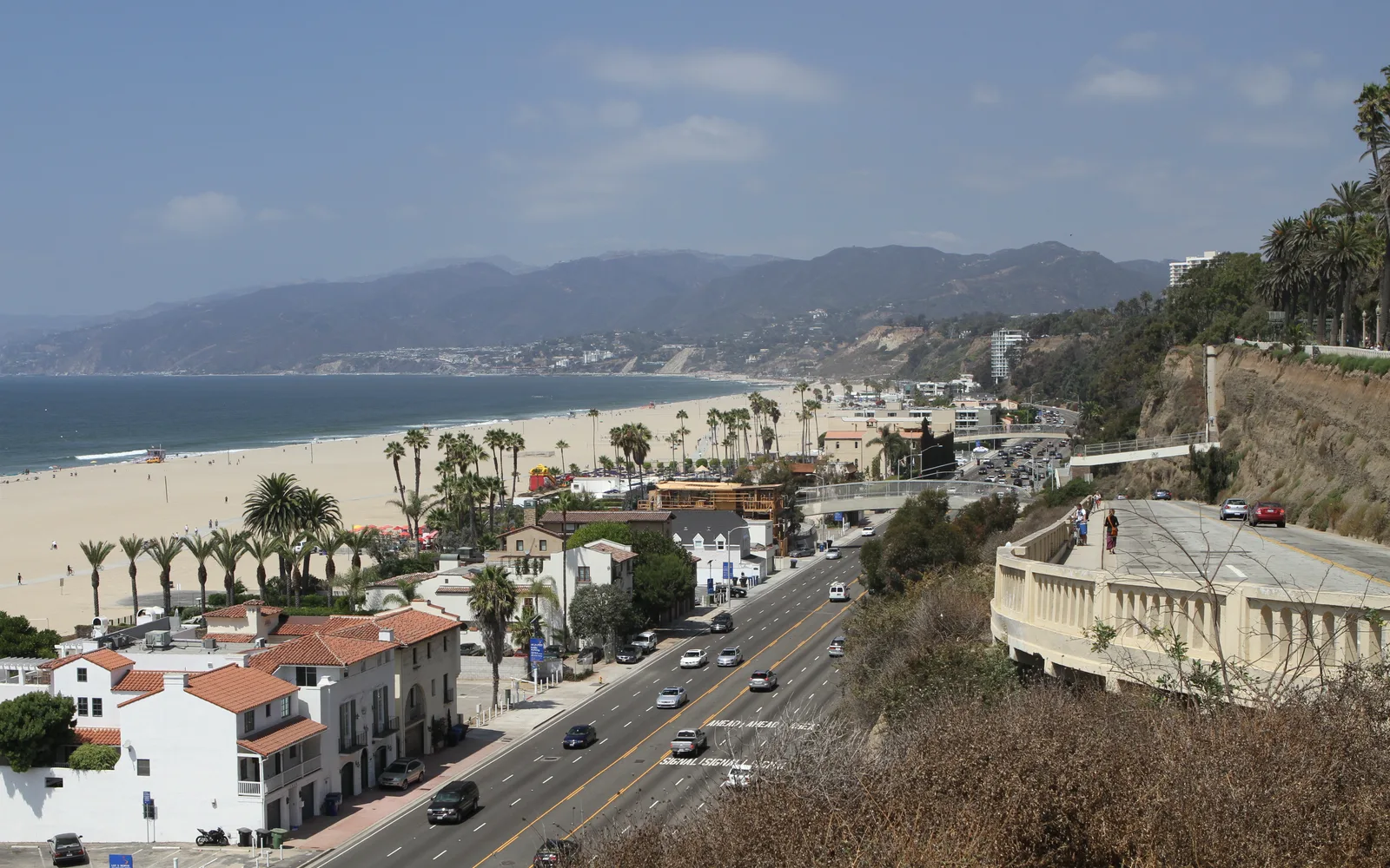 California beach with sandy shore and Pacific Ocean waves